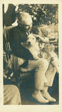 Item #13170 Photograph of the elderly Harding dandling a little girl on his knees, with her dog....