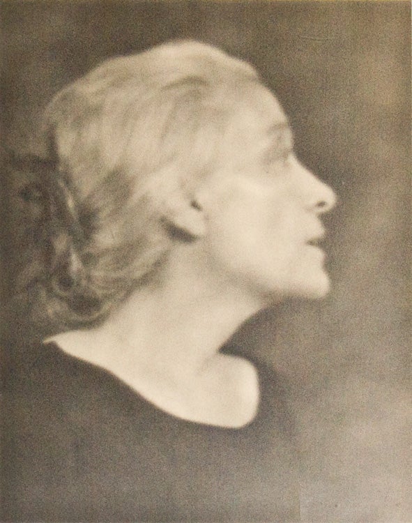 ELEONORA DUSE: Fine head and shoulders portrait photograph of the actress, with the photographer's label on verso. Gelatin silver print on smooth paper