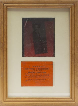 Item #20530 An ambrotype of a young man, seated with a lap robe at a table with a bottle of wine....