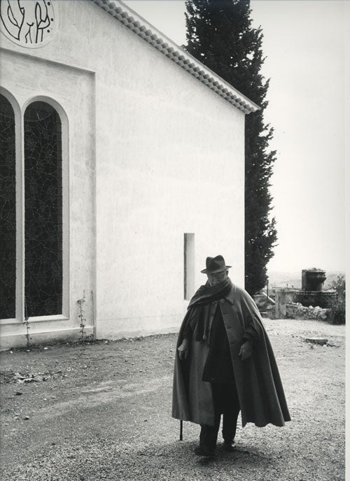 Item #232449 Portrait of Henri Matisse taking a stroll in front of the Chapelle Matisse in Vence. Henri Matisse, Dmitri Kessel, photographer.