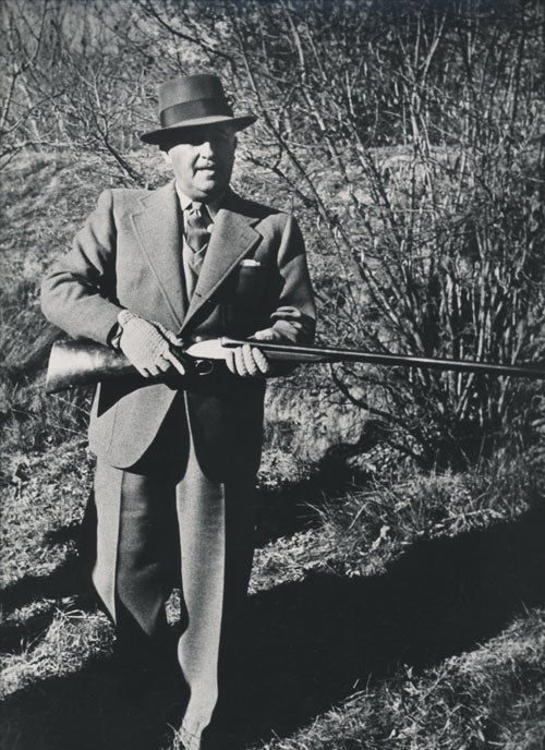 Item #232462 Photograph of Generalissimo Francisco Franco, hunting with a shotgun. Francisco Franco, Dmitri Kessel, photographer.
