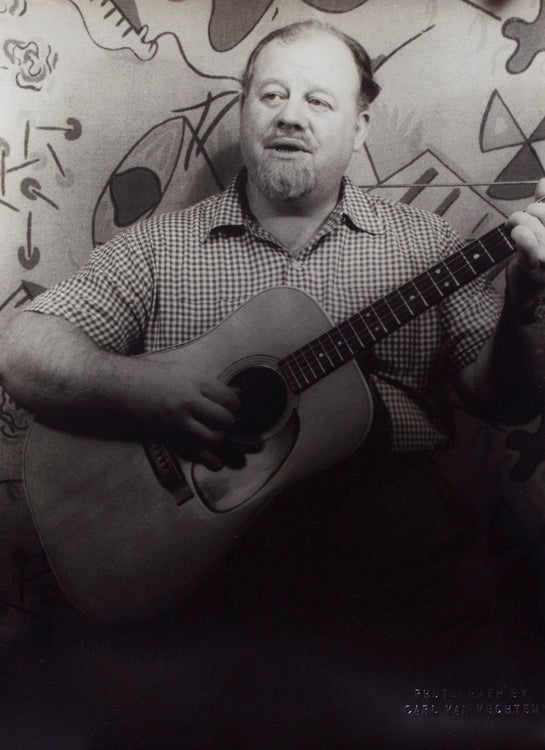 Item #261197 Portrait photograph of Burl Ives with guitar. Burl Ives, Carl Van Vechten.
