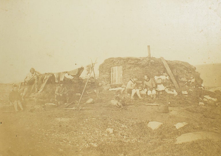Esquimaux Winter Hut and Its Occupants. The Entrance is seen on the Left
