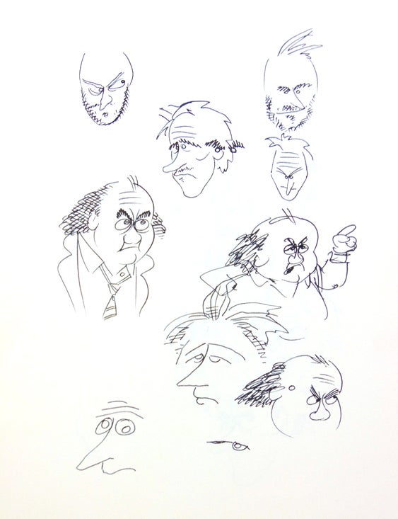 Two sketch books and loose pages containing original drawings and concept artwork