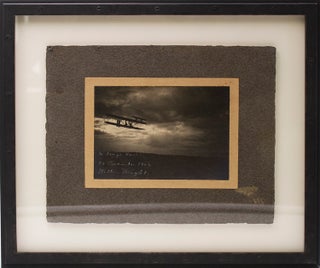 Item #314554 Photograph of Wilbur Wright in a Wright Flyer at twilight. Wilbur Wright