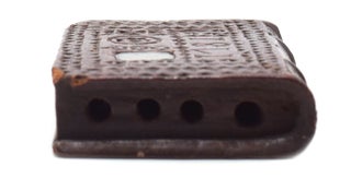 Chip-carved wooden book-form, dated 1781 on upper cover with small inlaid manuscript initials M.J. under glass, with 4 holes hand-drilled into the top likely for use as a quill holder