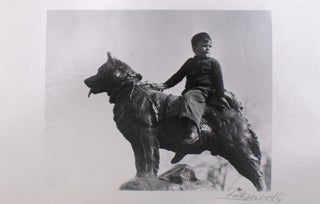 Item #329308 Untitled photograph of boy on dog statue, signed. Lotte Jacobi