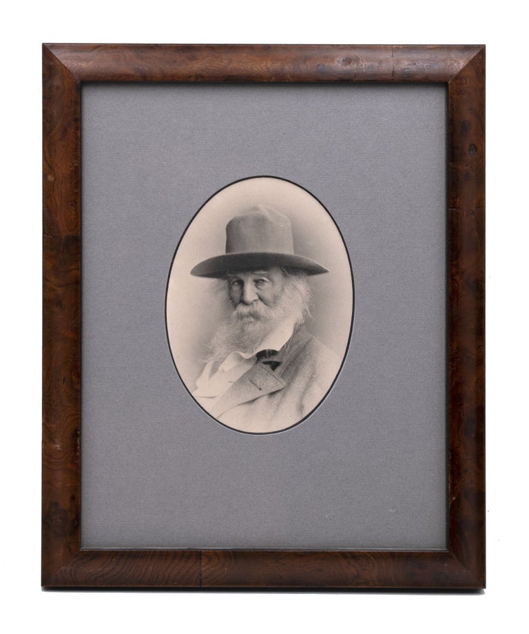 Phototype portrait of Walt Whitman, bearded, in soft hat and open collar shirt and jacket
