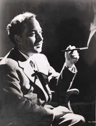 Item #339308 Tennessee Williams, seated and smoking, photograph from the National Film Archive