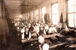 Item #345222 Photo of factory with workers at their benches with aprons, both men and women
