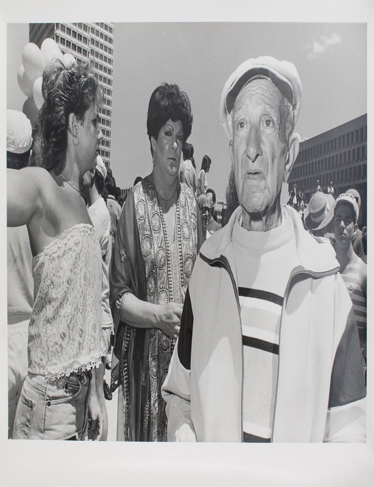 Item #346618 Gay Pride Parade, 1988 [old man with drag queen in background]. Roswell Angier.