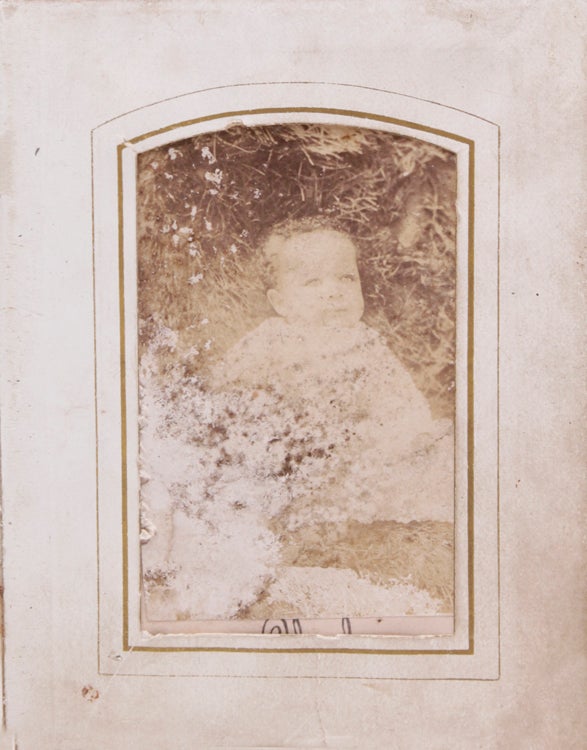 [Small album of tintypes and cdvs of African American men, women and children, plus cdvs of prints of Lincoln reading to Tad and Lincoln on he death bed]