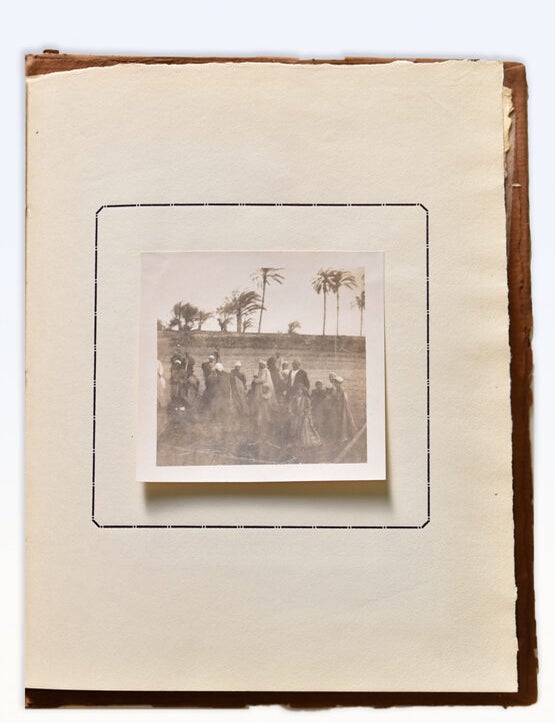 Album with 25 tipped-in photographs with accompanying printed text. no title