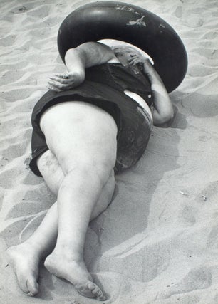 Item #353847 Coney Island Beach People. Untitled [Woman Sleeping in Inner Tube]. Harry Lapow