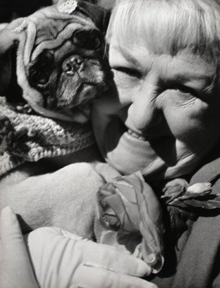 Item #353853 Untitled photograph. [Woman Smiling with Pug Dog; Easter Parade]. Harry Lapow