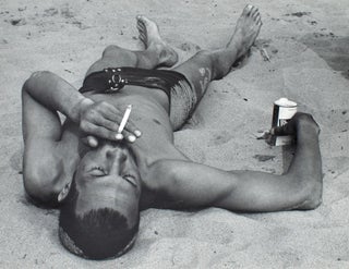 Item #353946 Coney Island Beach People. Untitled [Man Smoking While Lying on a Beach]. Harry Lapow