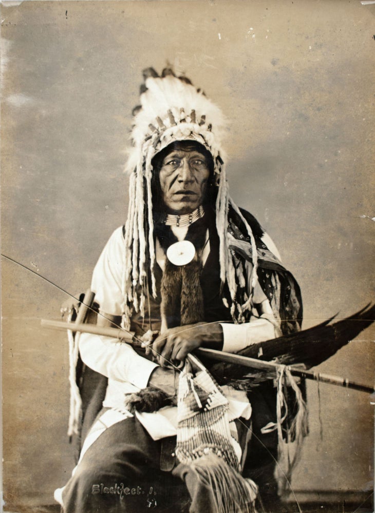 Item #365585 Portrait of Pehzi or Pah-Zhe, Known As John Grass, Also Called Waha-Canka-Yapi (Used As A Shield), in Partial Native Dress with Headdress and Holding Pipe, Bag and Fan, 1872]. Native Americans, Alexander Gardner, photographer.