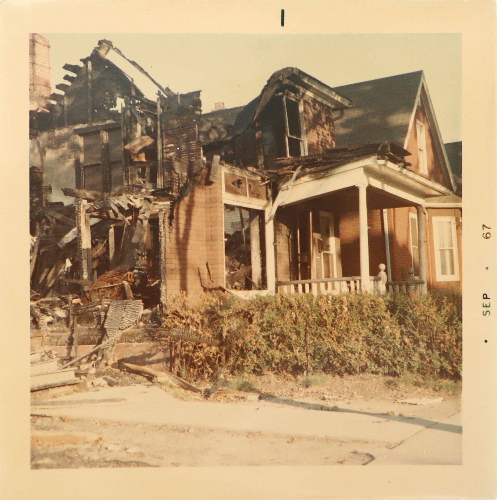Collection of color photographs documenting the aftermath of the 1967 ...
