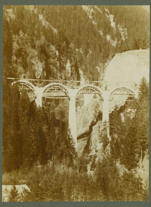 Six Photographs of the construction of an Alpine bridge across a pass in the Swiss Alps